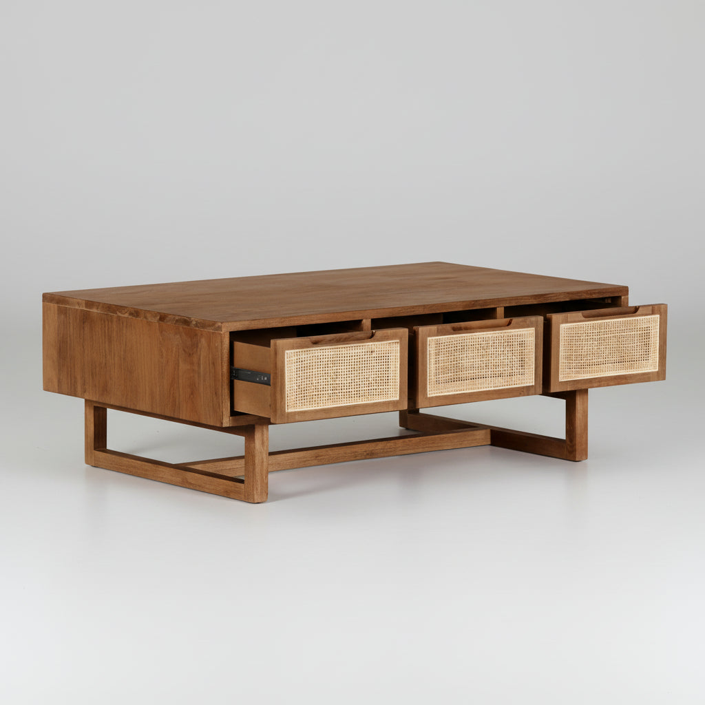 Wooden coffee table with wicker drawer fronts on a white background